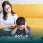 Therapist observes autistic boy in focused activity, symbolizing assessment and evaluation for high-functioning autism.