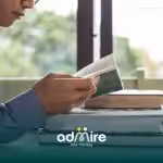 Therapist reads at a desk with stacked books, highlighting concentration, learning, and independent study skills.