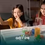 Two autistic kids conducting a simple science experiment together, symbolizing curiosity, learning styles, & neurodiversity.