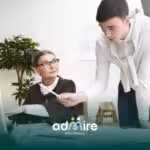 Therapist  gently checking on a sleeping autistic child on a couch at night, illustrating caregiving, comfort, and bedtime
