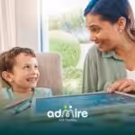 Therapist guides autistic girl during therapy using colorful learning toys on floor, encouraging fine motor skills, & focus