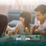 Therapist participate in an in-home ABA therapy activity with autistic child using colorful toys and creative play materials