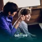 Therapist and autistic child engaging in a communication-focused interaction to build social and listening skills.