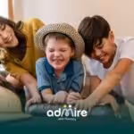 Therapist & autistic kids enjoying playful weekend activities at home, supporting family bonding during ABA therapy