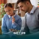 ABA therapist reviews notes with autistic child in focused session, building academic progress and communication skills.
