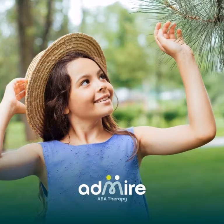 Smiling autistic girl holds toy with therapist, symbolizing progress and positive outcomes of ABA therapy.