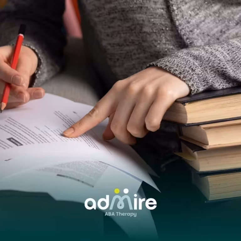 A therapist reviewing printed material and highlighting text, showing focus, comprehension, and academic learning strategies.