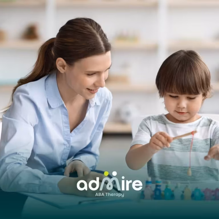 A therapist and autistic boy work together with colorful blocks, engaging in an educational activity with focus and enjoyment.
