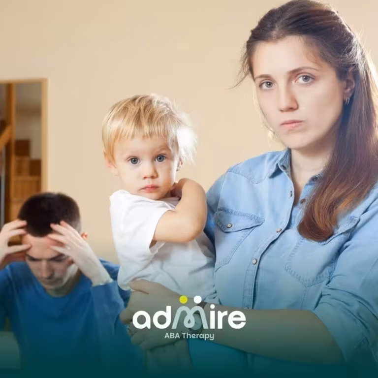 Parent holds autistic toddler as another adult looks stressed, reflecting family concerns and autism misconceptions.