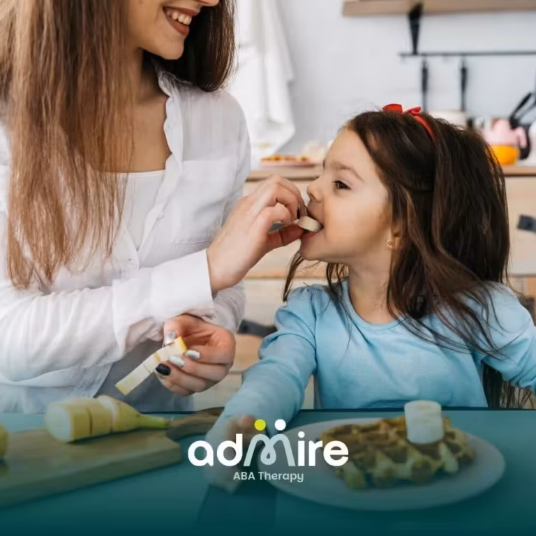Therapist offering a banana slice to an autistic girl during breakfast, supporting healthy eating habits and food acceptance.