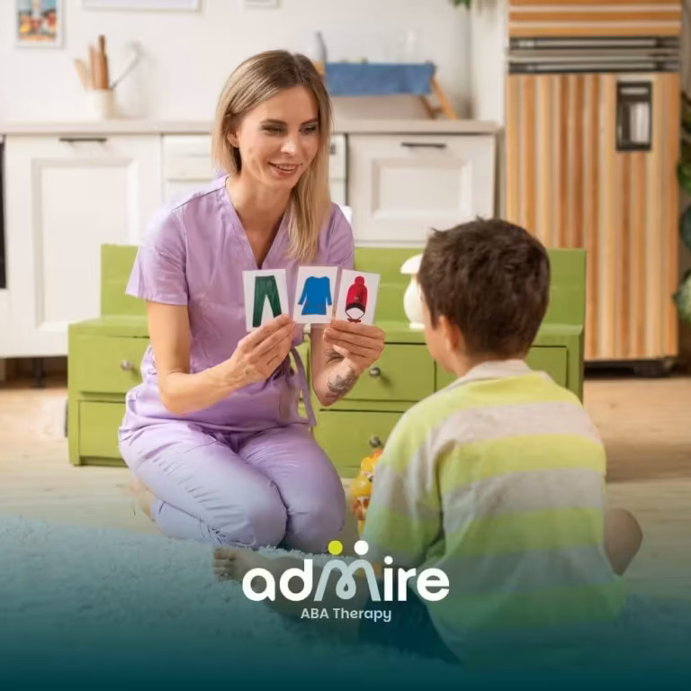 A therapist and autistic boy play a matching game with visual cards, working on building cognitive skills in a cozy home.