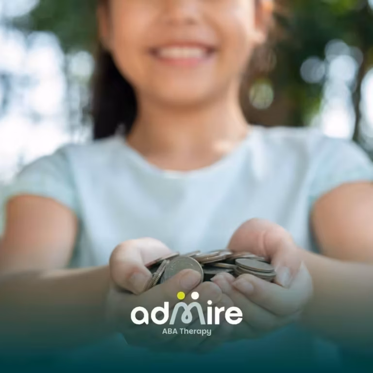 Smiling autistic child holding out coins with both hands outdoors, symbolizing savings or financial support.