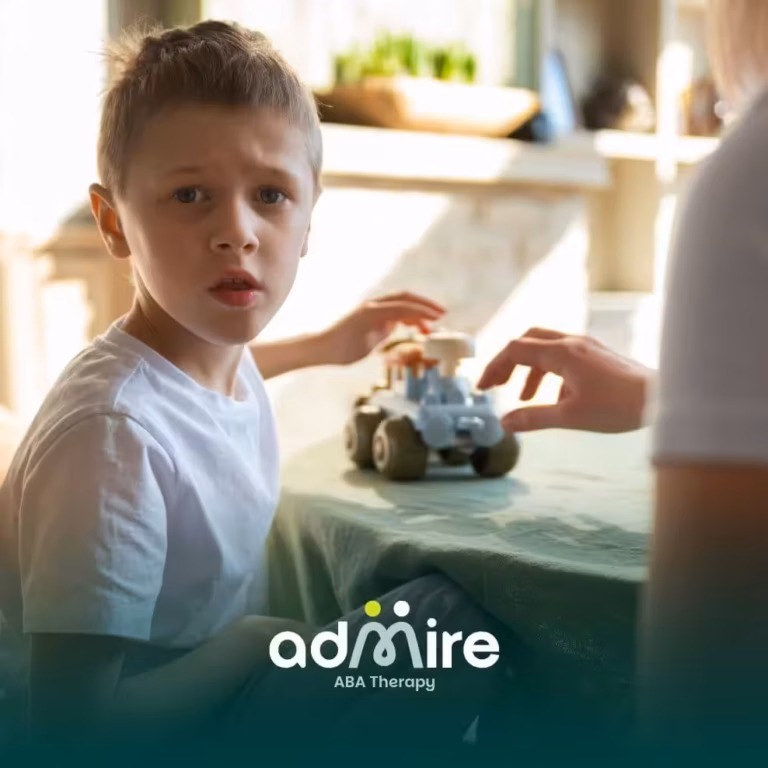 Therapist and autistic girl read together at a table, symbolizing long-term support, learning, and developmental growth.