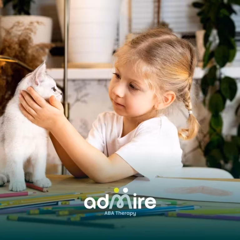 Autistic girl gently interacting with her pet cat at a table, supporting emotional connection and social development.