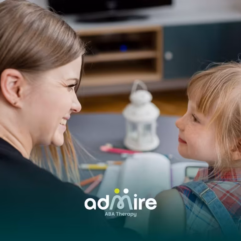 Smiling therapist and autistic girl make warm eye contact while reading together, encouraging communication during therapy