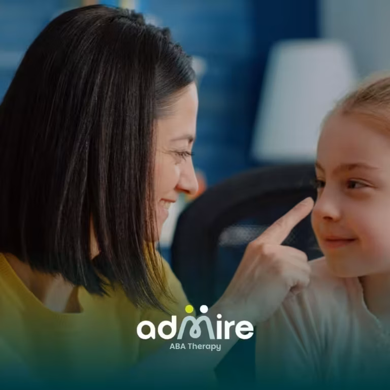 A therapist playfully pointing at an autistic girl as they share a joyful moment together, sitting across from each other.
