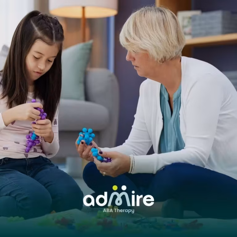 Therapist works with autistic child & parent in clinic, discussing treatment plan and supporting autism care & ABA progress